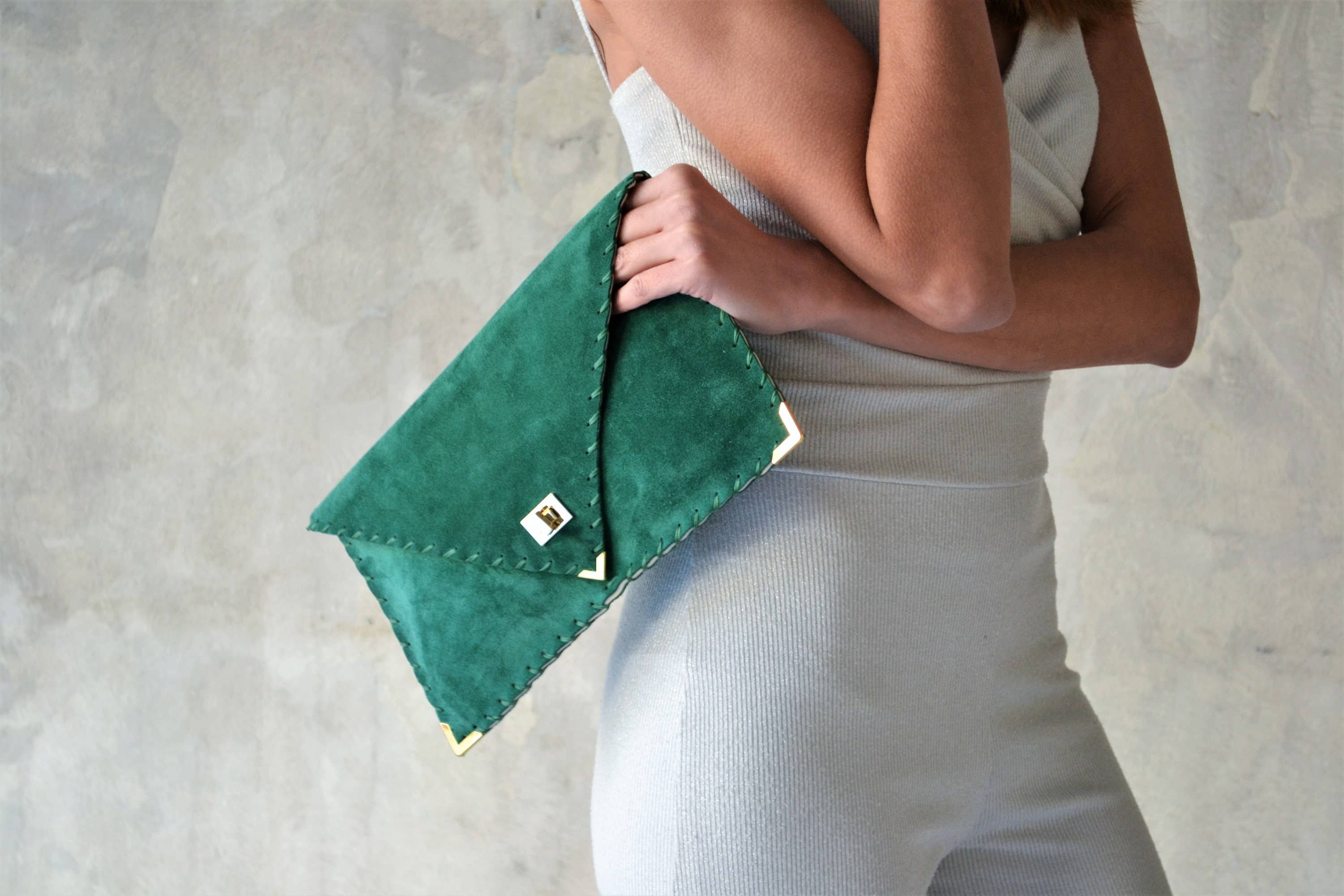 Symmetria suede clutch in emerald