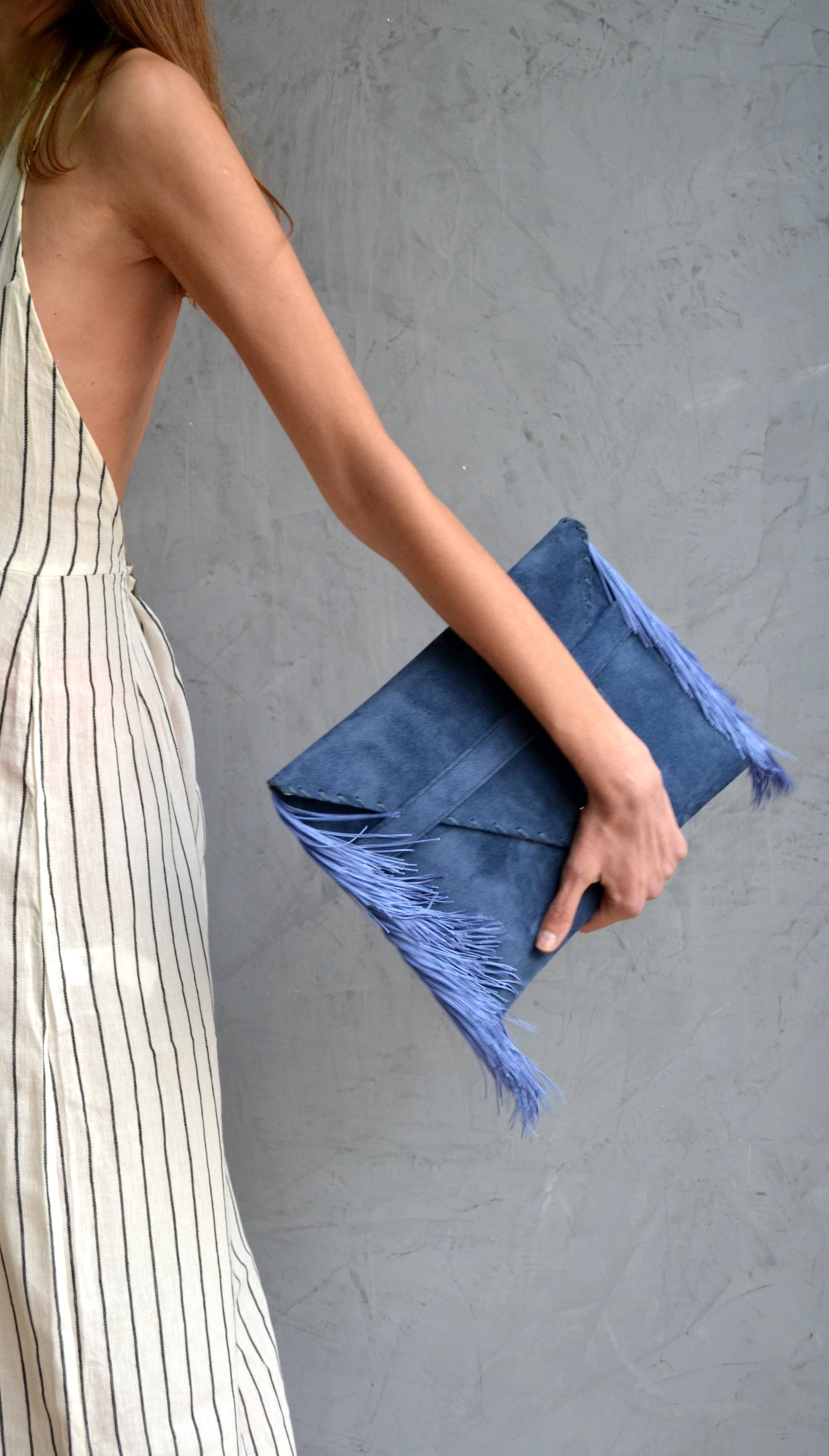 Medusa clutch in raf blue with silk fringes