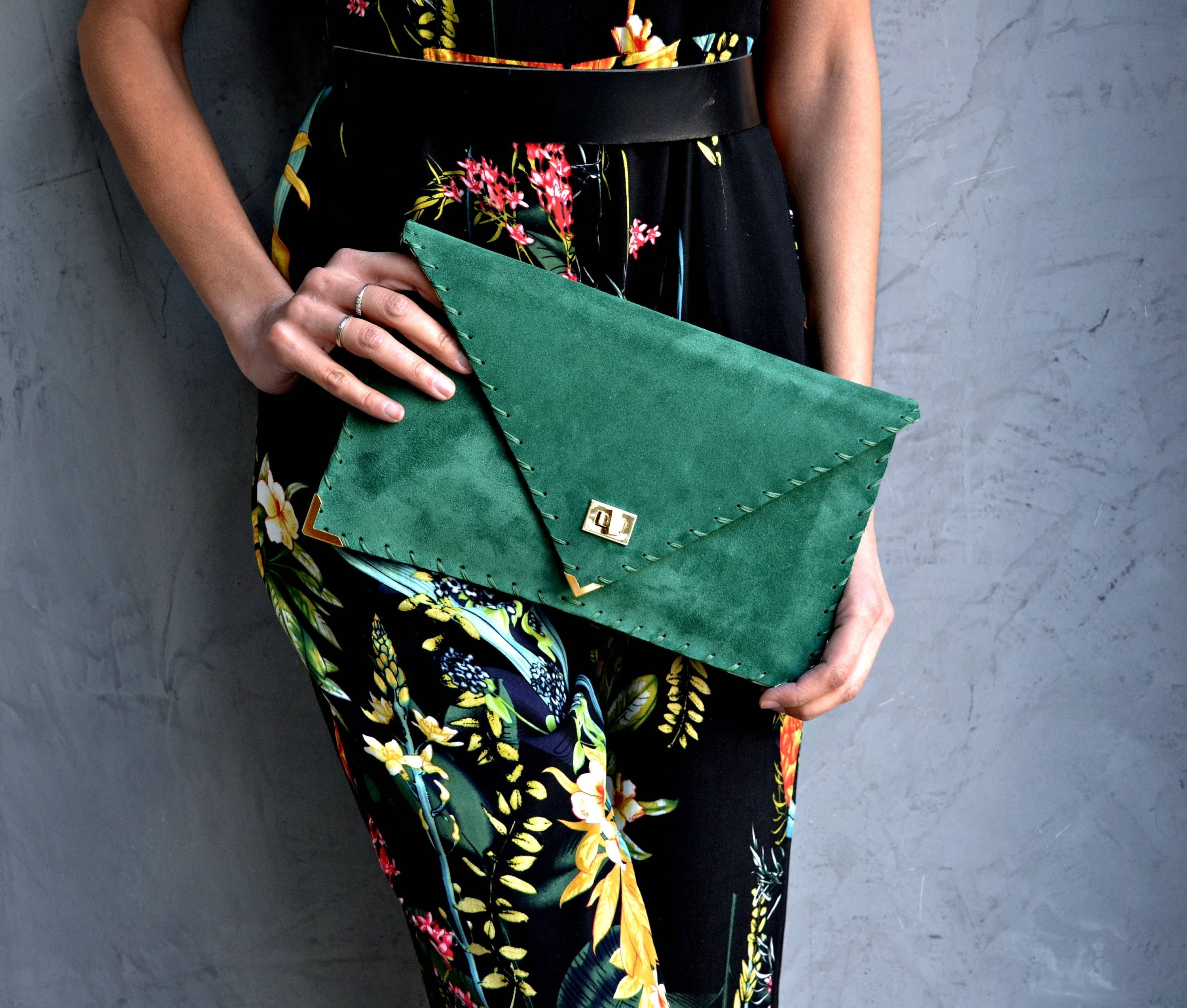 Symmetria suede clutch in emerald