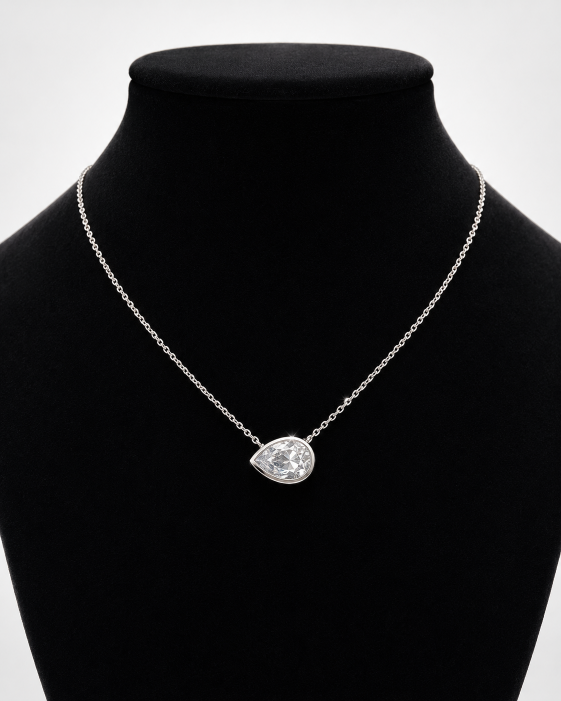 Sterling silver bezel set pear shape CZ