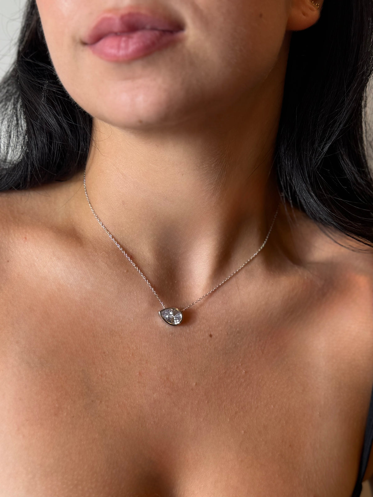 Sterling silver bezel set pear shape CZ
