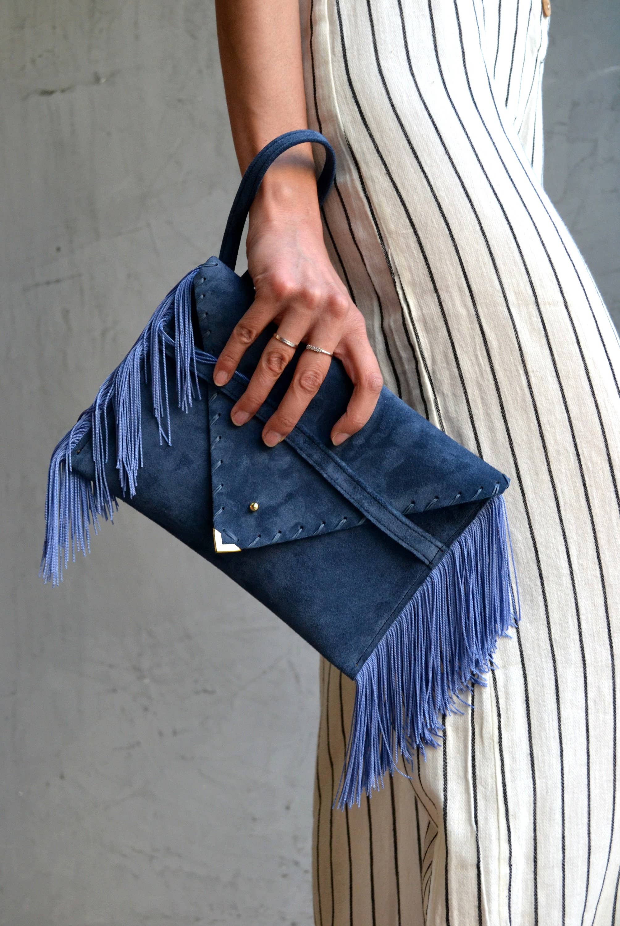 Medusa clutch in raf blue with silk fringes