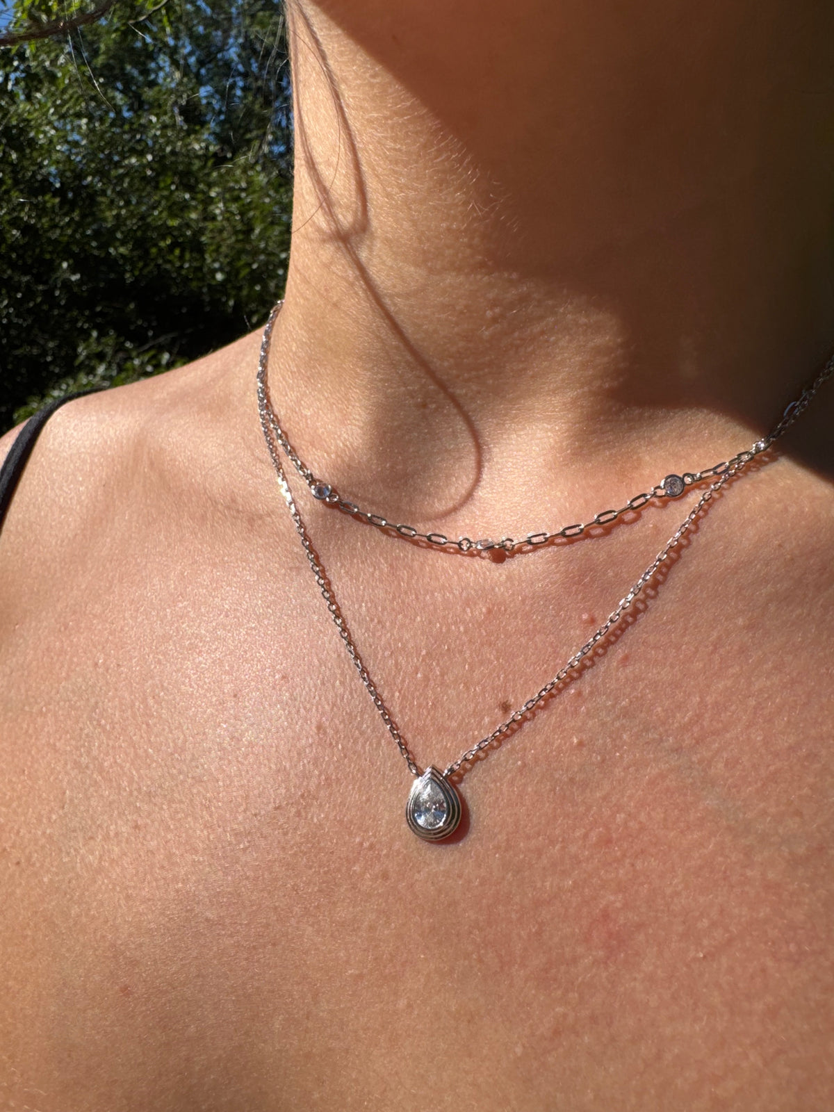 Sterling silver pear shape bezel set CZ pendant