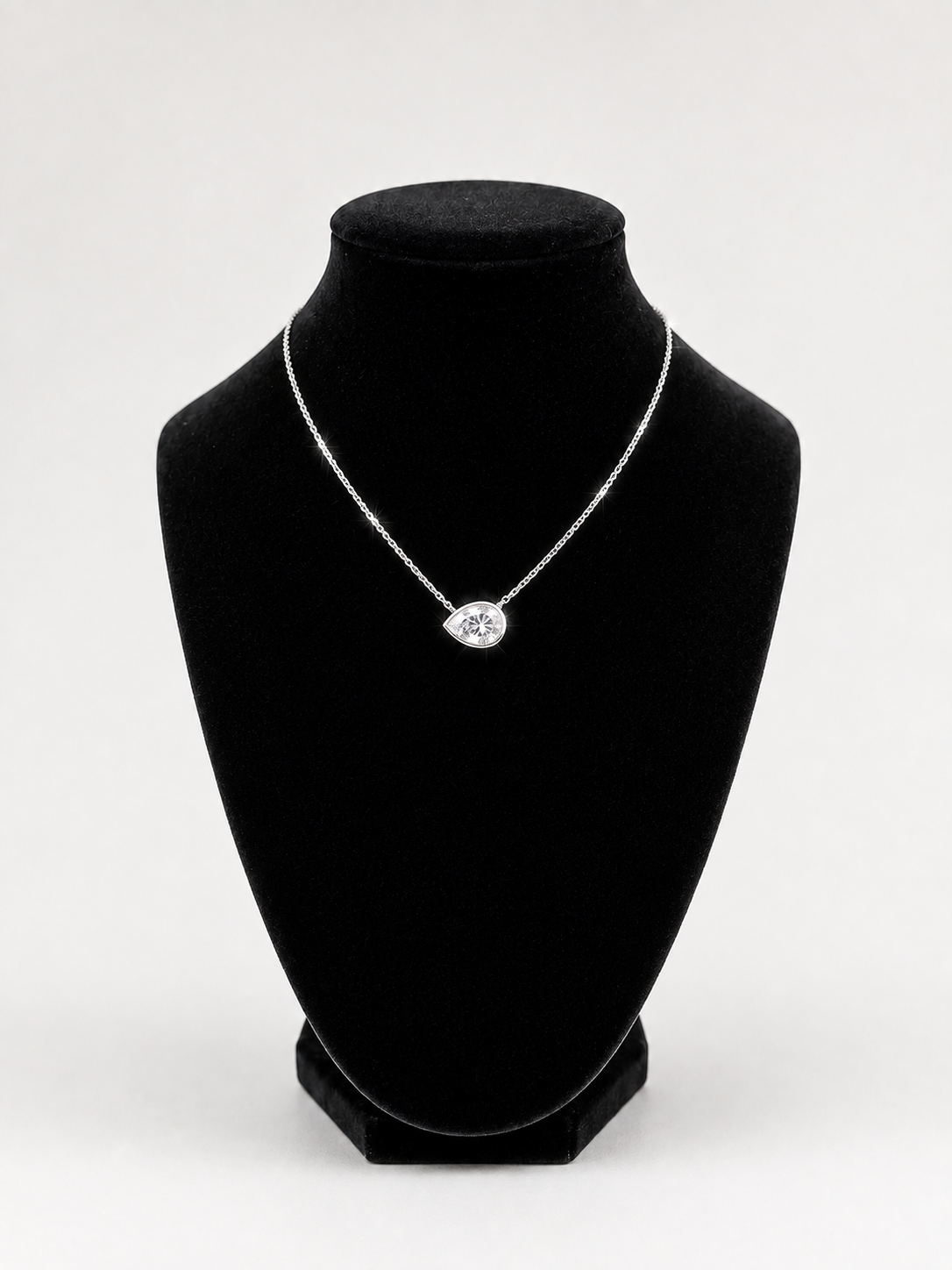 Sterling silver bezel set pear shape CZ